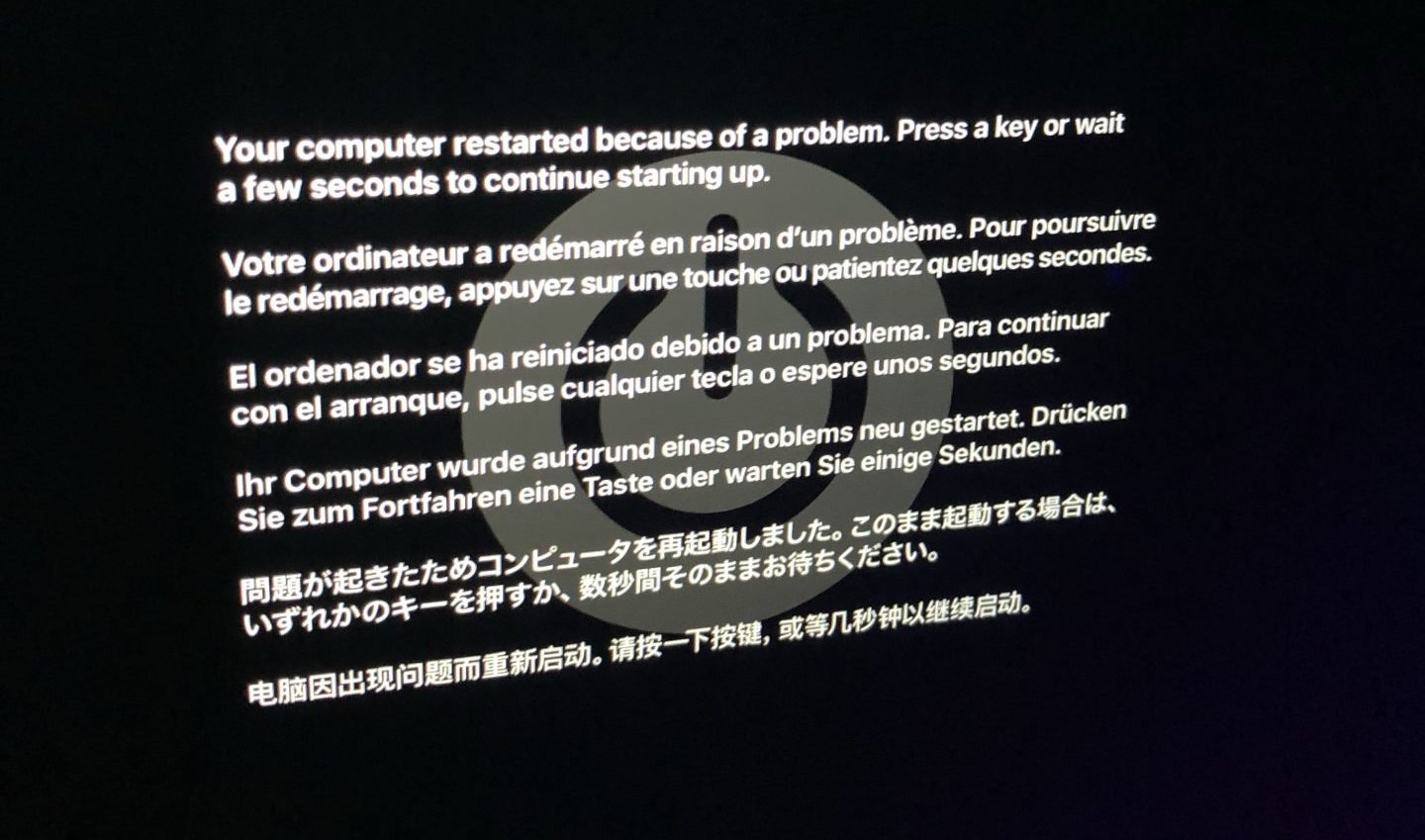 Screenshot of a macOS error "Your computer restarted because of a problem. Press a key or wait a few seconds to continue starting up."